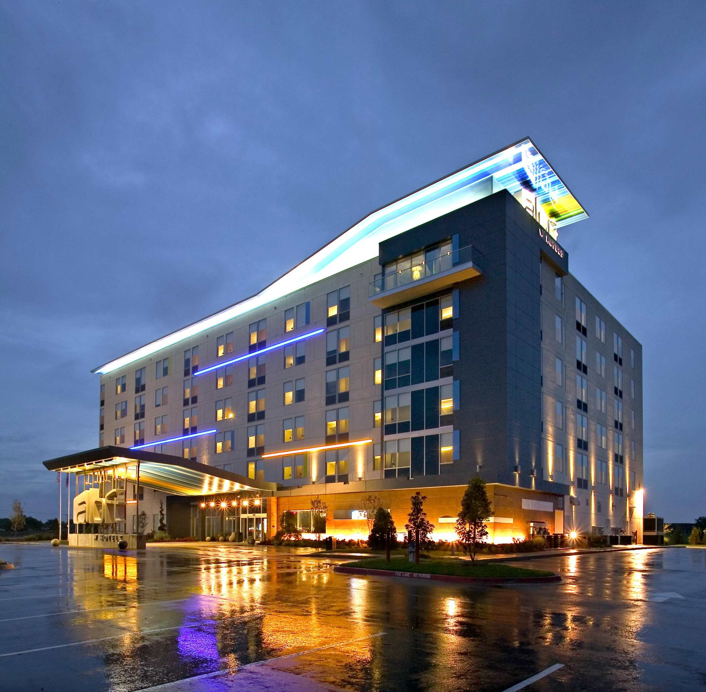 Upscale hotel property with modern design and illuminated facade